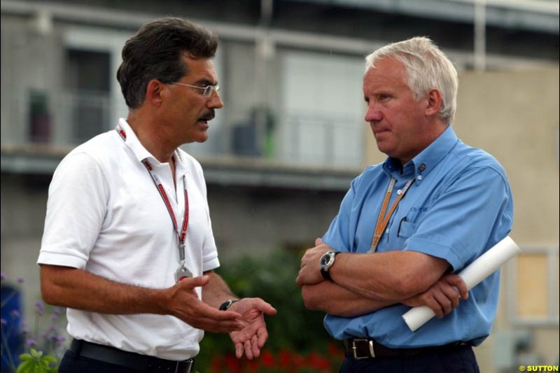 Dr Mario Thiessen and Charlie Whiting, United States GP, Thursday June 18th, 2004.