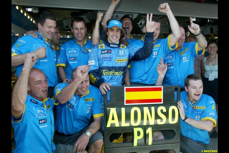 Fernando Alonso celebrates his first pole position of the season. Saturday practice and qualifying for the French Grand Prix. Magny Cours, France. July 3rd 2004.