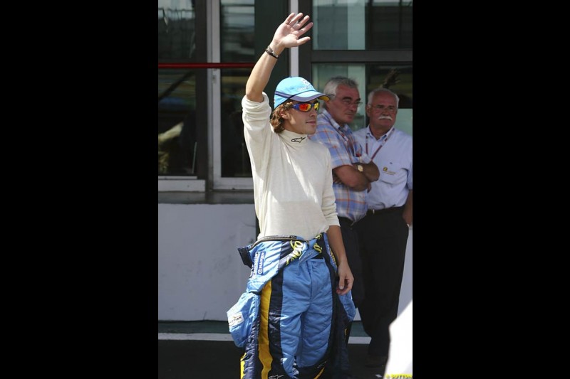 Fernando Alonso celebrates his first pole position of the season. Saturday practice and qualifying for the French Grand Prix. Magny Cours, France. July 3rd 2004.