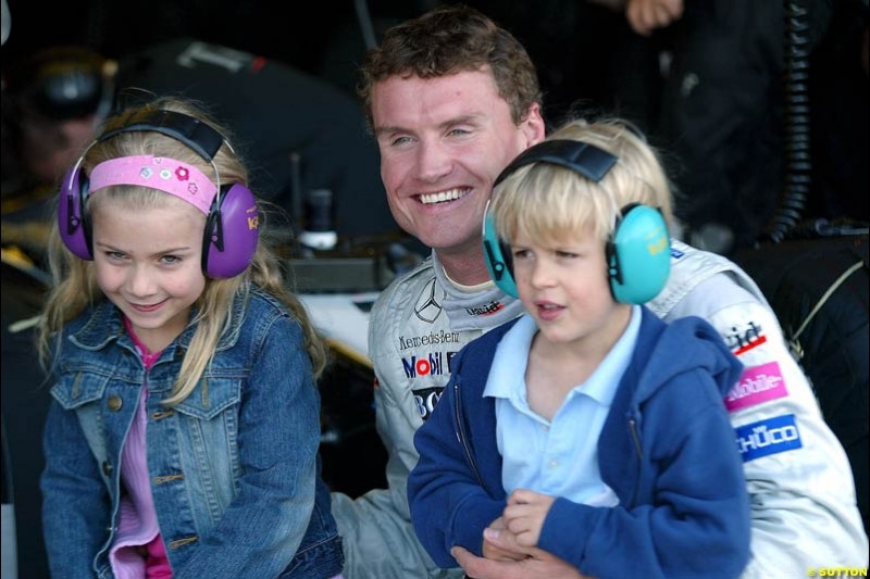 David Coulthard with the grandchildren of Sir Jackie Stewart. Silverstone testing, Wednesday July 14th, 2004.