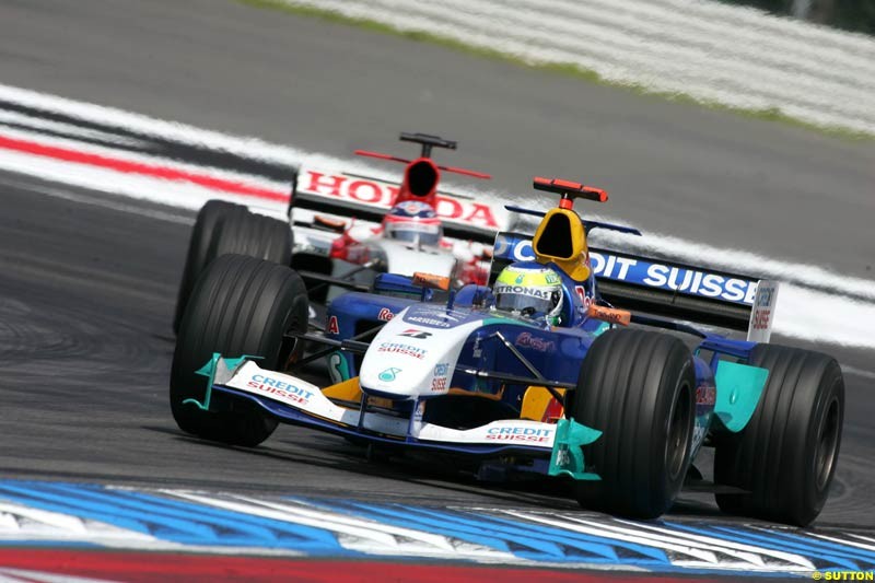 Giancarlo Fisichella, Sauber; Takuma Sato, BAR-Honda, German GP, Sunday July 25th, 2004.