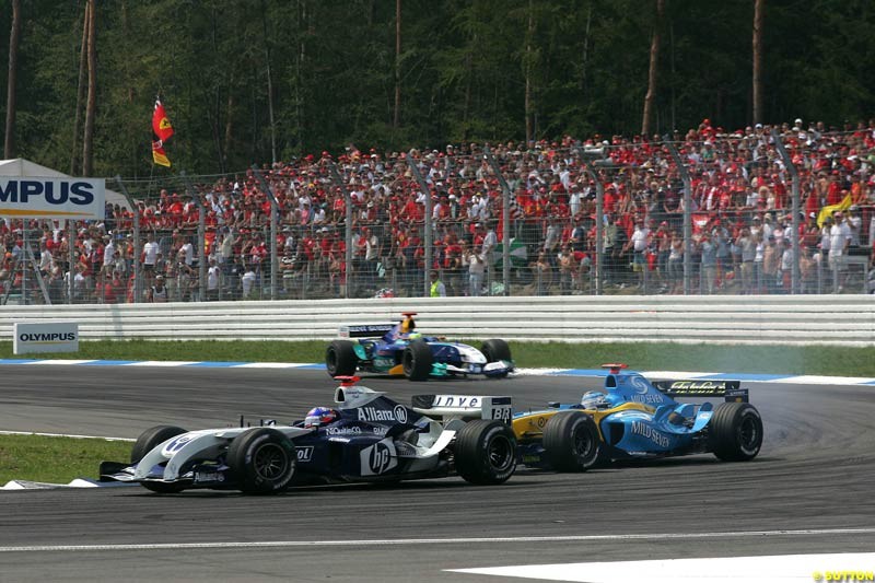 Juan Pablo Montoya, BMW Williams; passes Fernando Alonso, Renault; German GP, Sunday July 25th, 2004.