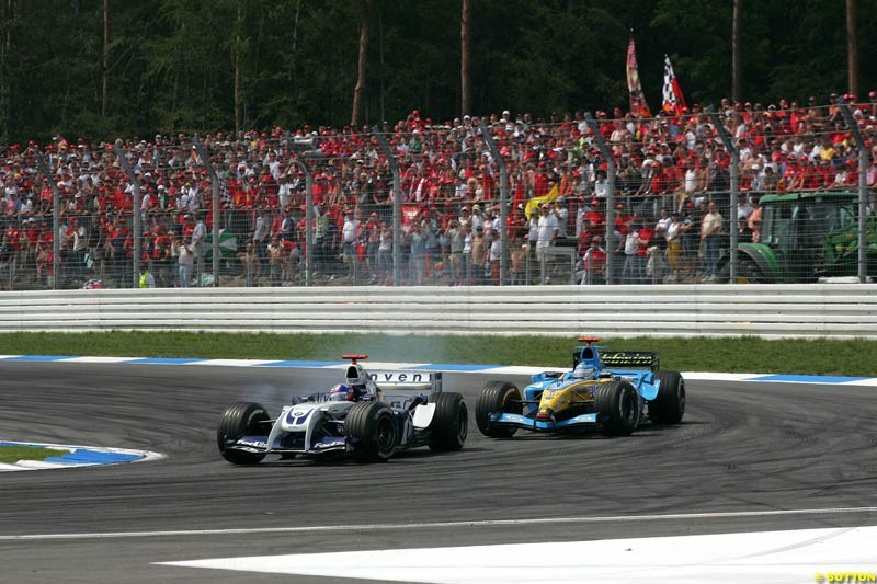 Juan Pablo Montoya, BMW Williams; passes Fernando Alonso, Renault; German GP, Sunday July 25th, 2004.