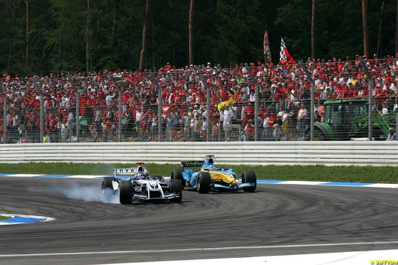 Juan Pablo Montoya, BMW Williams; passes Fernando Alonso, Renault; German GP, Sunday July 25th, 2004.