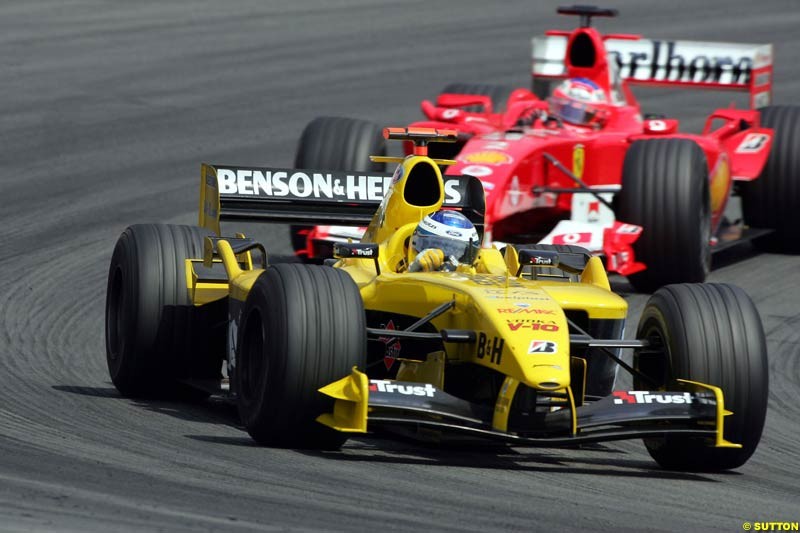 Nick Heidfeld, Jordan-Ford; Rubens Barrichello, Ferrari; German GP, Sunday July 24h, 2004.