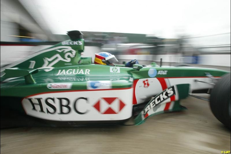 Renault test driver Fernando Alonso tries the Jaguar R3. 2002 Formula One Testing, Silverstone, England. 30th May 2002.