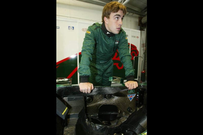 Renault test driver Fernando Alonso tries the Jaguar R3. 2002 Formula One Testing, Silverstone, England. 30th May 2002.