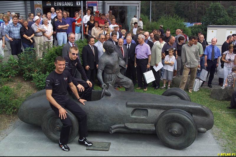 On 19 June 1927, 75 years ago, Rudolf Caracciola won the inaugurating race at the Nurburgring with a Mercedes S. On the occasion of that anniversary, West McLaren Mercedes drivers David Coulthard and Kimi Raikkonen drove Caracciola's car around the Grand Prix track. Earlier that day, David and Kimi unveiled a Juan Manuel Fangio statue in front of the Nurburgring Erlebniswelt.