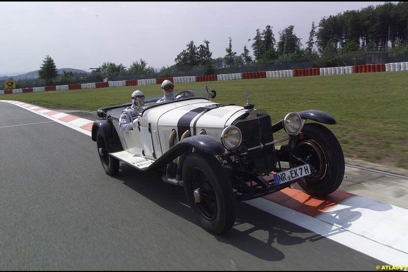 On 19 June 1927, 75 years ago, Rudolf Caracciola won the inaugurating race at the Nurburgring with a Mercedes S. On the occasion of that anniversary, West McLaren Mercedes drivers David Coulthard and Kimi Raikkonen drove Caracciola's car around the Grand Prix track. Earlier that day, David and Kimi unveiled a Juan Manuel Fangio statue in front of the Nurburgring Erlebniswelt.