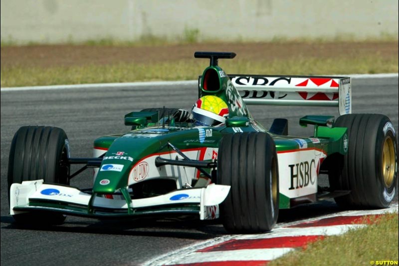 Mark Webber (AUS) tests the Jaguar R3. Formula One Testing, Barcelona, Spain, 2June 8 2002.
