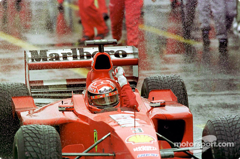 Rain master Michael Schumacher celebrating his victory