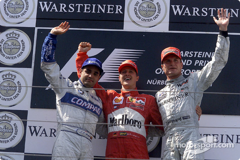 The podium: Juan Pablo Montoya, Michael Schumacher and David Coulthard