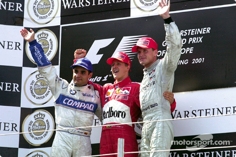 The podium: Juan Pablo Montoya, Michael Schumacher and David Coulthard