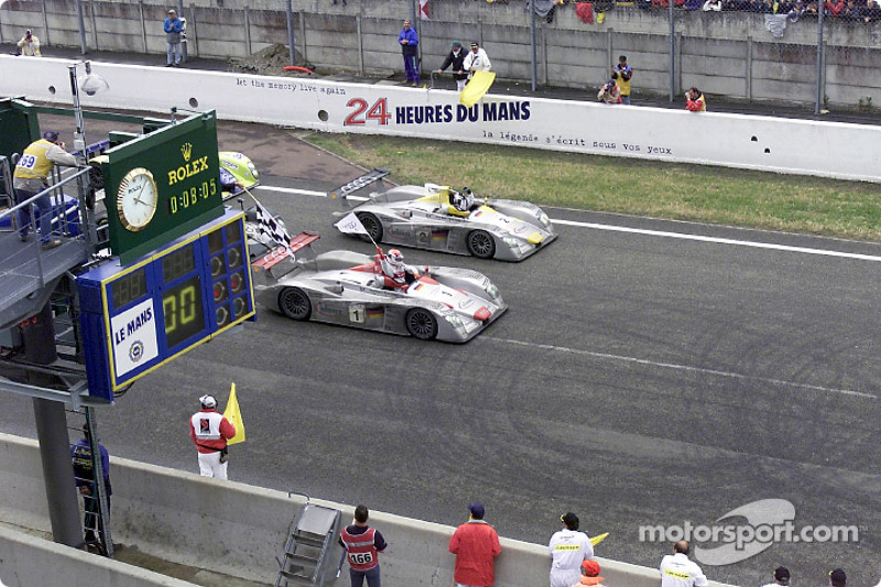 Audi celebrates a 1-2 at Le Mans: Emanuele Pirro in the Infineon Audi R8 (#1) crosses the finishing 