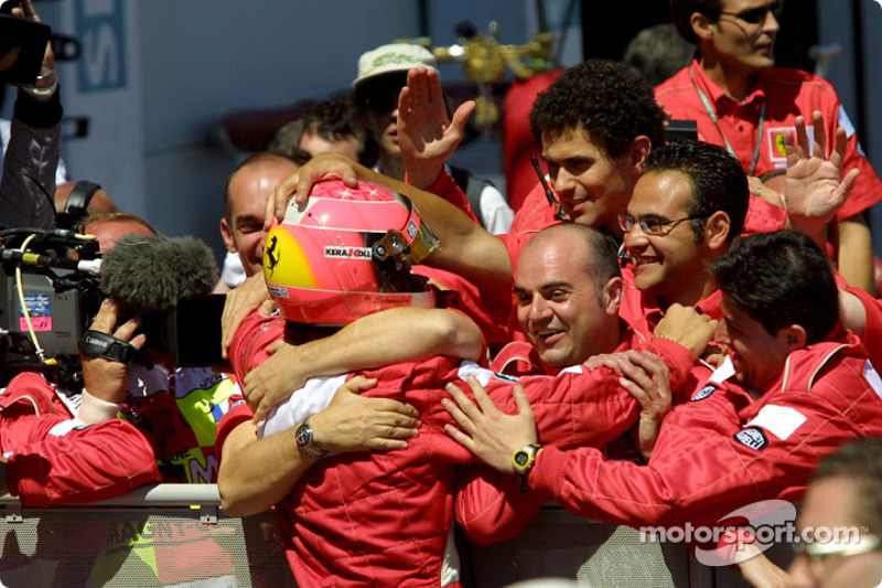 Michael Schumacher celebrating with his crew