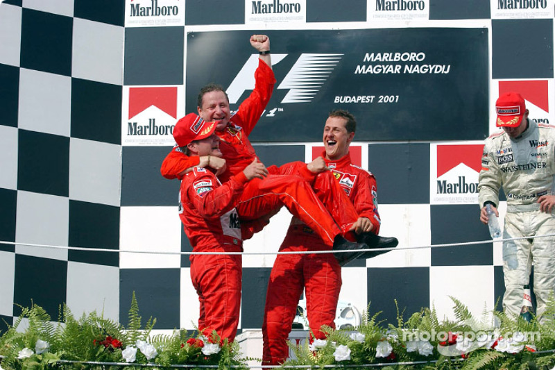 Michael Schumacher, Rubens Barrichello and Jean Todt celebrating