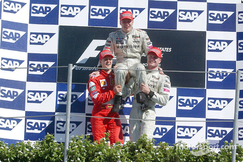 The podium: race winner Mika Hakkinen with Michael Schumacher and David Coulthard