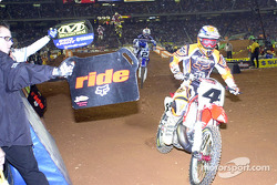 Ricky Carmichael and Jeremy McGrath fly past the mechanic's area and get their lap times