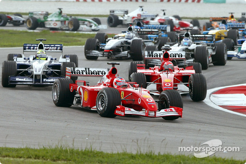 First corner: Rubens Barrichello leading Ralf Schumacher and Michael Schumacher