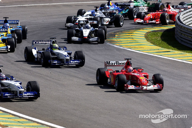 First corner: Michael Schumacher about to pass Juan Pablo Montoya