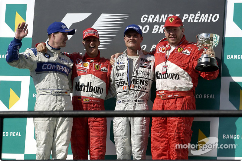 The podium: race winner Michael Schumacher with Ralf Schumacher, David Coulthard and Ross Brawn