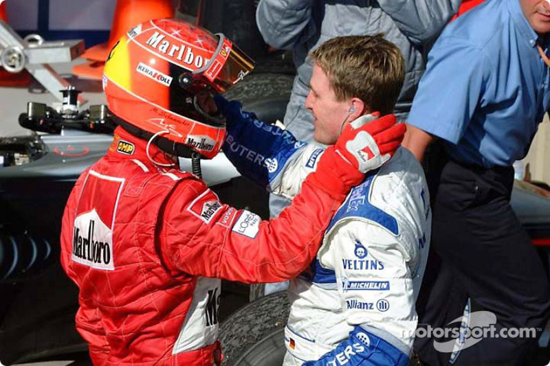 Race winner Michael Schumacher and brother Ralf