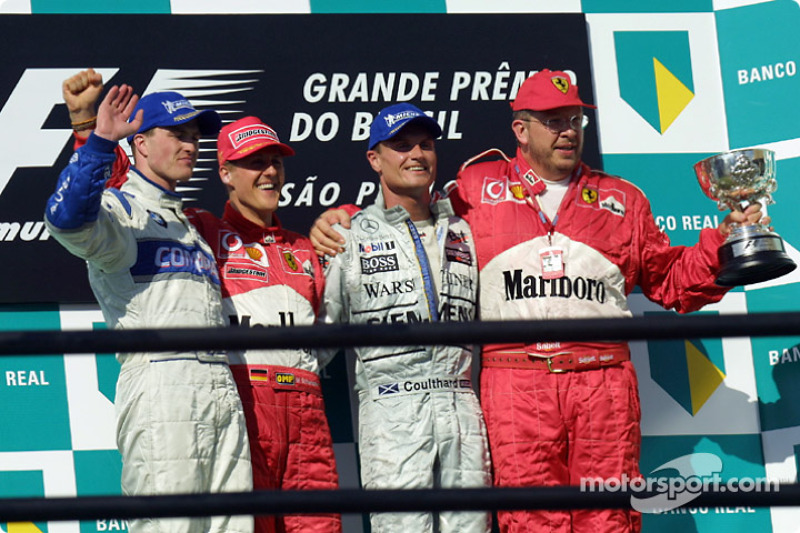 The podium: race winner Michael Schumacher with Ralf Schumacher, David Coulthard and Ross Brawn