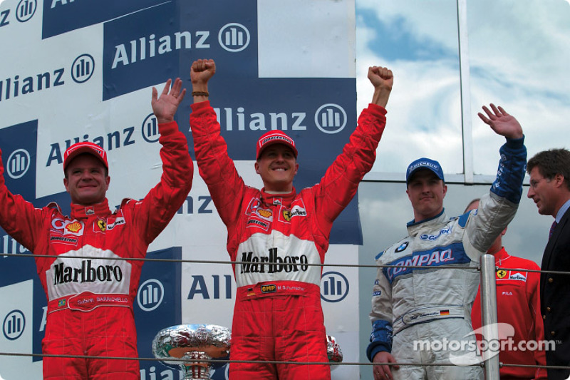 The podium: race winner Michael Schumacher with Rubens Barrichello and Ralf Schumacher