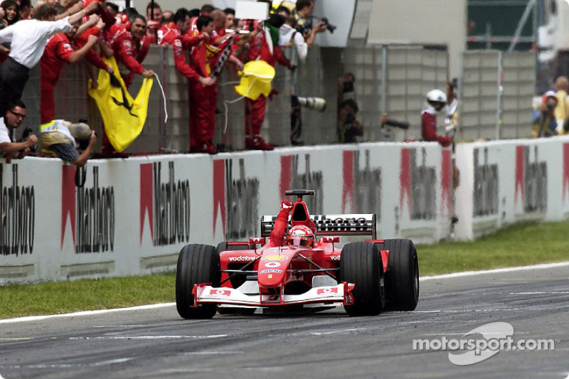 Michael Schumacher taking the checkered flag