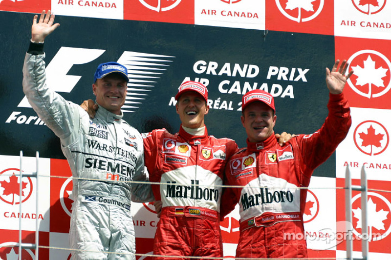 The podium: race winner Michael Schumacher with David Coulthard and Rubens Barrichello