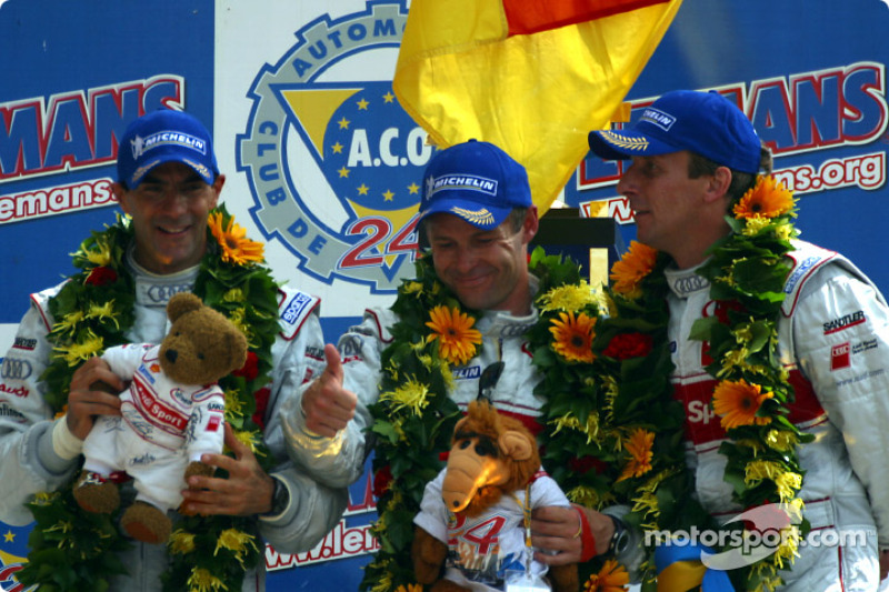 The overall and LMP 900 - LM GTP podium: race winners Emanuele Pirro, Tom Kristensen and Frank Biela