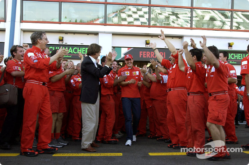 Michael Schumacher and Team Ferrari celebrating