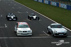 Juan Pablo Montoya in the WilliamsF1 BMW FW24, Bruno Giacomelli in the BMW Z8, Tom Coronel in the BM