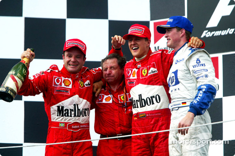 The podium: race winner Rubens Barrichello with Jean Todt, Michael Schumacher and Ralf Schumacher