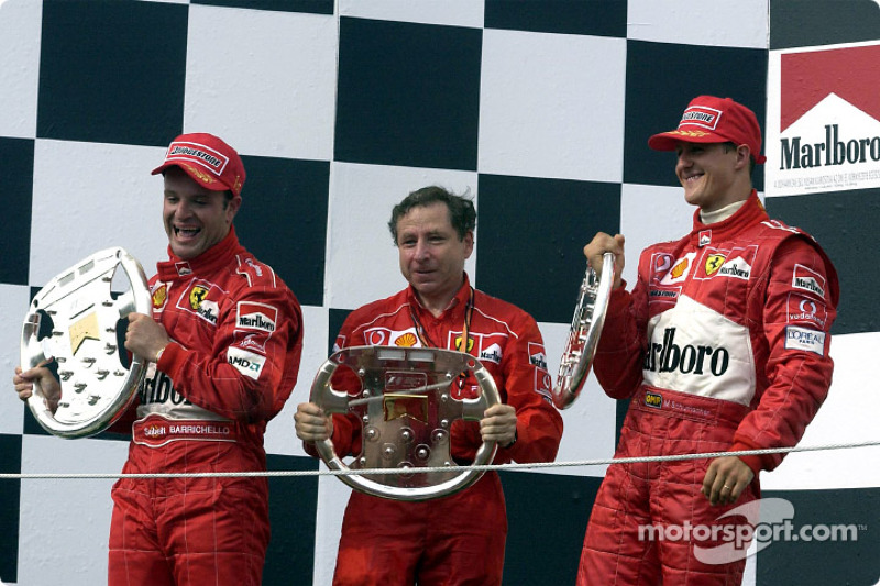 The podium: race winner Rubens Barrichello with Jean Todt and Michael Schumacher