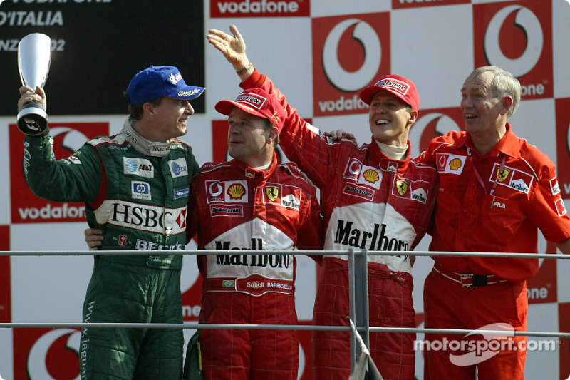 The podium: race winner Rubens Barrichello with Michael Schumacher and Eddie Irvine