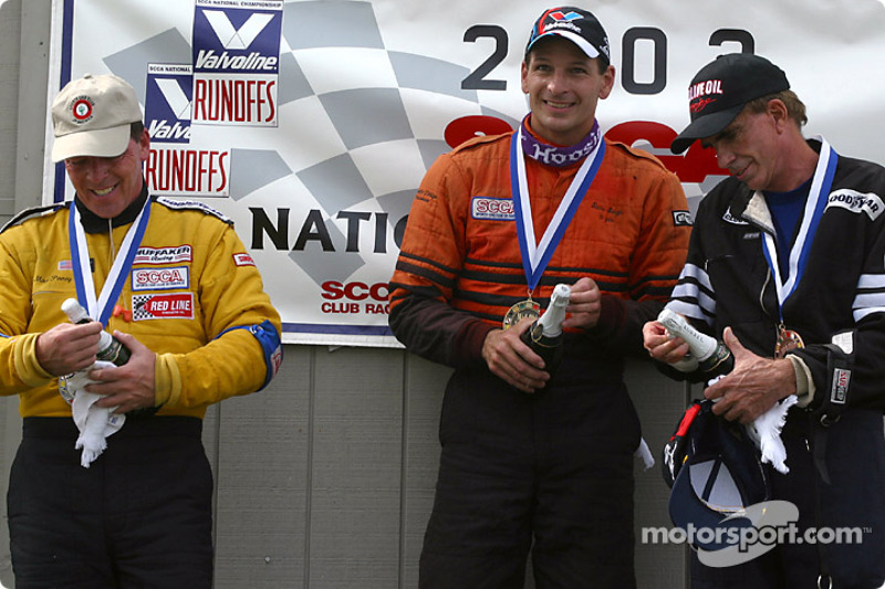 The podium: champagne for Steve Sargis, Michael Pinney and Charles Guest