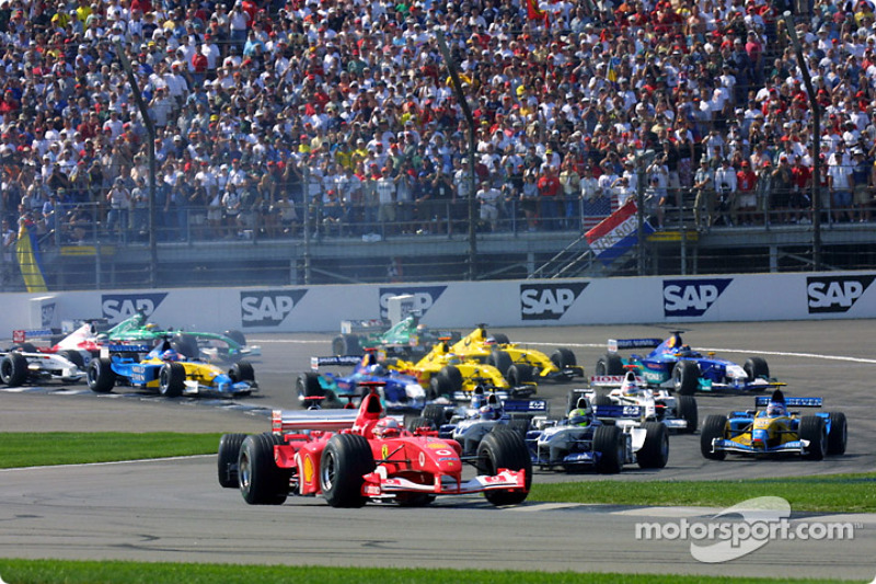 First corner: Michael Schumacher leads the field