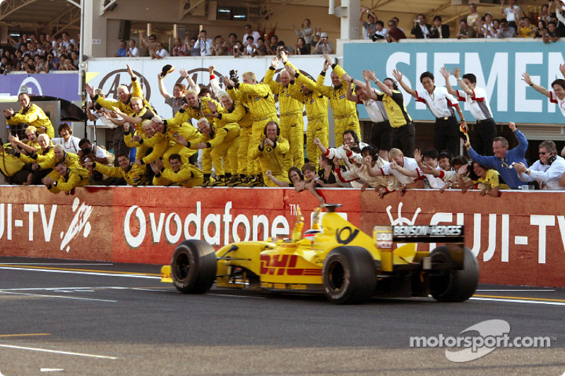 Takuma Sato celebrates his first points in Formula 1