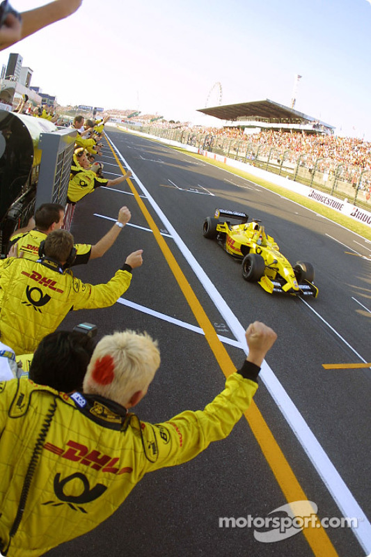 Takuma Sato celebrates his first points in Formula 1