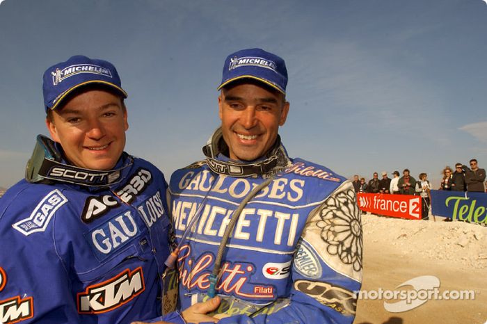Winner Richard Sainct celebrates with Fabrizio Meoni
