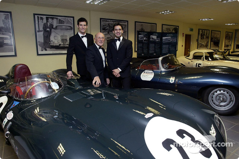 Sir Stirling Moss poses with Jaguar F1 drivers Mark Webber and Antonio Pizzonia at the launch of the