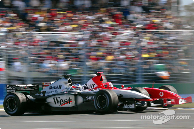 Michael Schumacher tries to pass Kimi Raikkonen