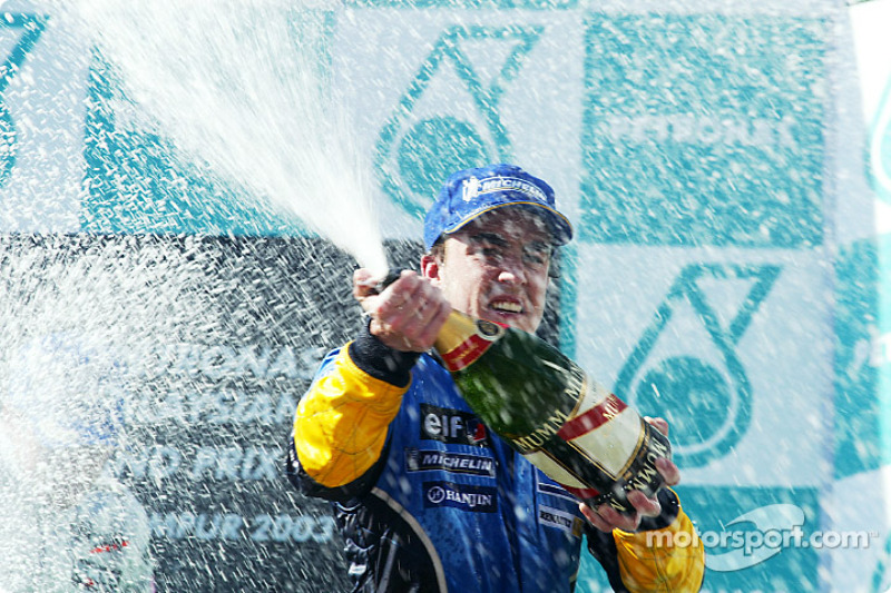 The podium: champagne for Fernando Alonso