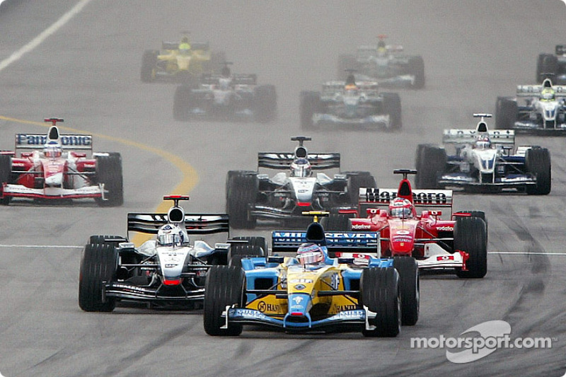 The start: Jarno Trulli battles with David Coulthard