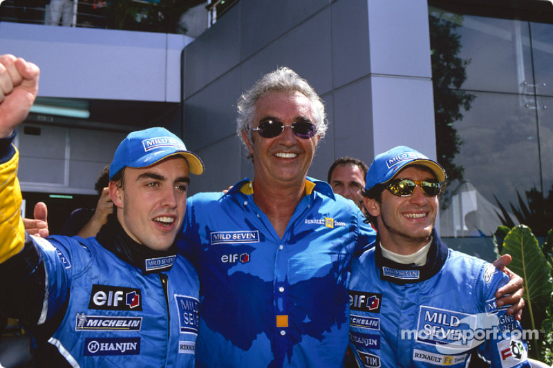 Fernando Alonso, Falvio Briatore and Jarno Trulli celebrate first row