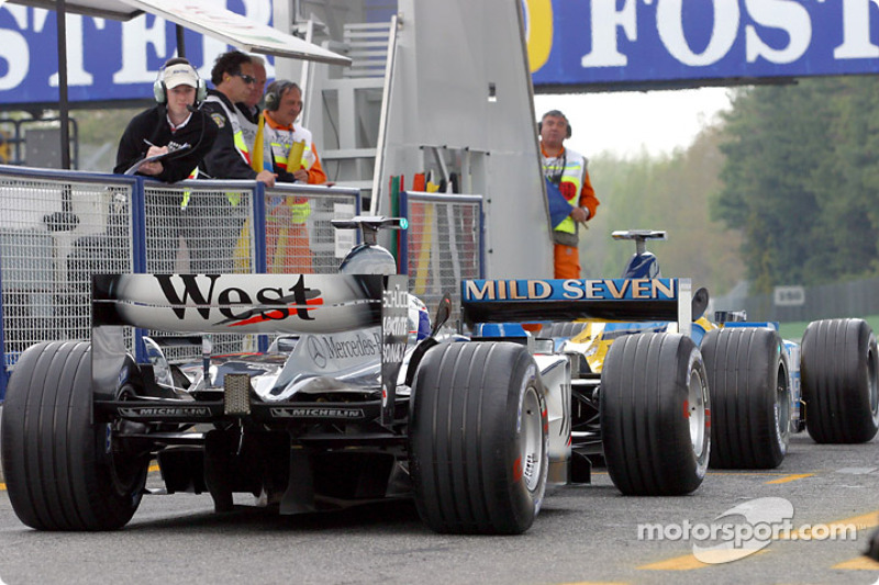 Pit exit: Fernando Alonso and David Coulthard