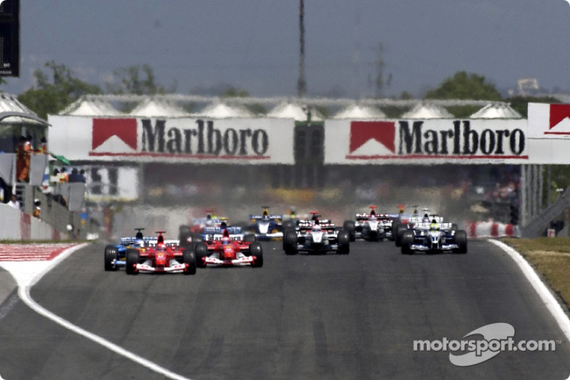 start: Michael Schumacher takes lead ve Fernando Alonso ve Rubens Barrichello