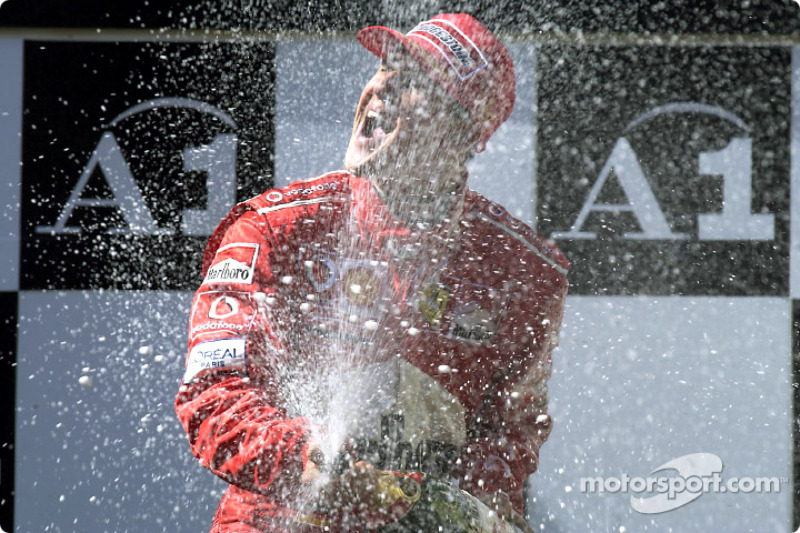 The podium: champagne for Michael Schumacher