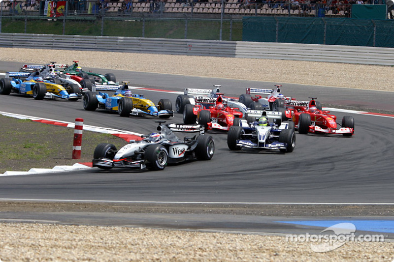 The start: Kimi Raikkonen takes the lead in front of Ralf Schumacher